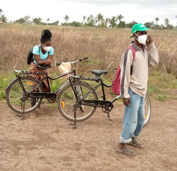 Counselors from the Kuphezana CBO—Rosário and Bias Alberto—visit patients living in remote communities to distribute medicines, conduct preventive visits, and connect new patients with care. Photo Credit: Kuphezana for Abt Global